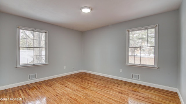 unfurnished room featuring light wood-type flooring