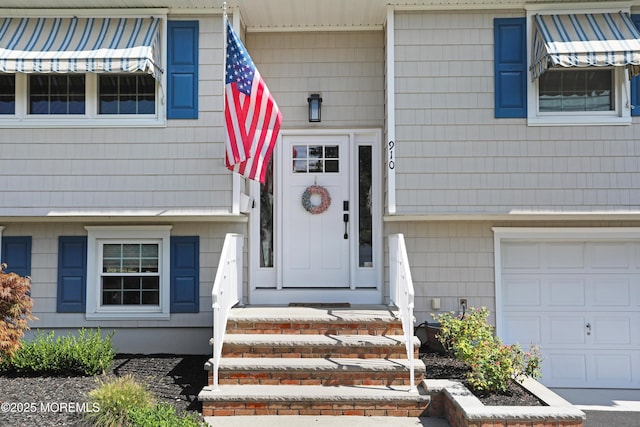 entrance to property featuring a garage