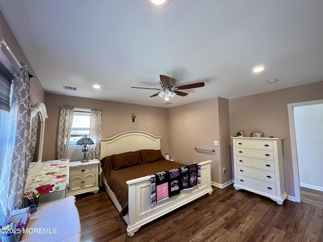 bedroom with ceiling fan and dark hardwood / wood-style flooring