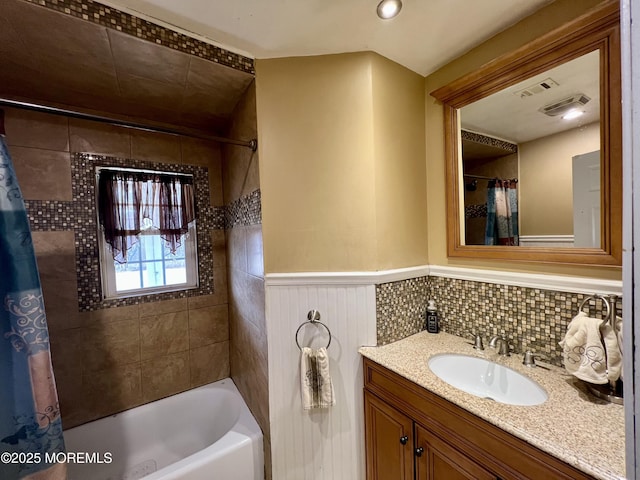 bathroom with vanity and shower / bath combo