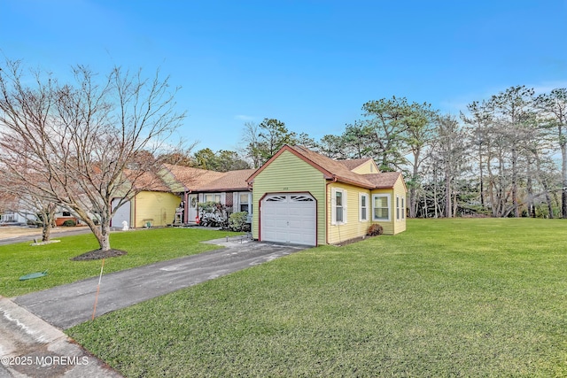 view of front facade with a garage and a front lawn