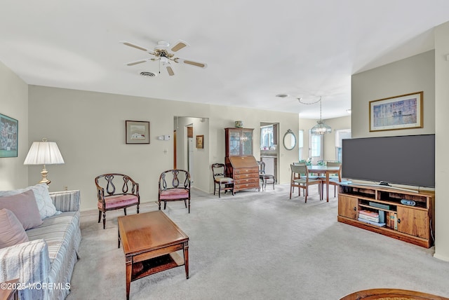 living room with light carpet and ceiling fan