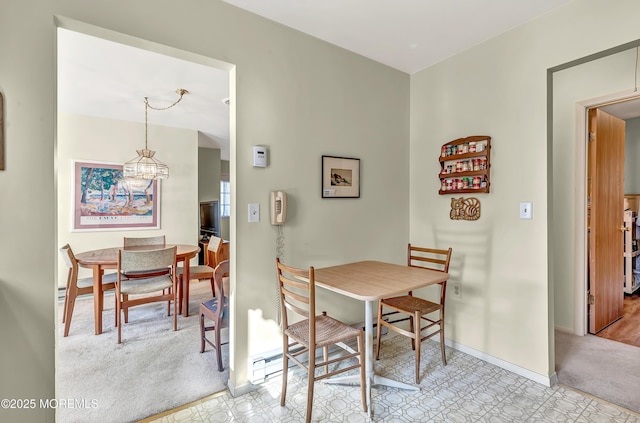 view of carpeted dining area