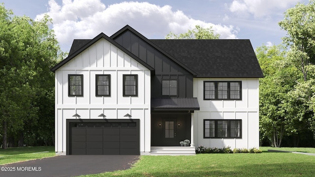 view of front of property featuring a garage and a front yard