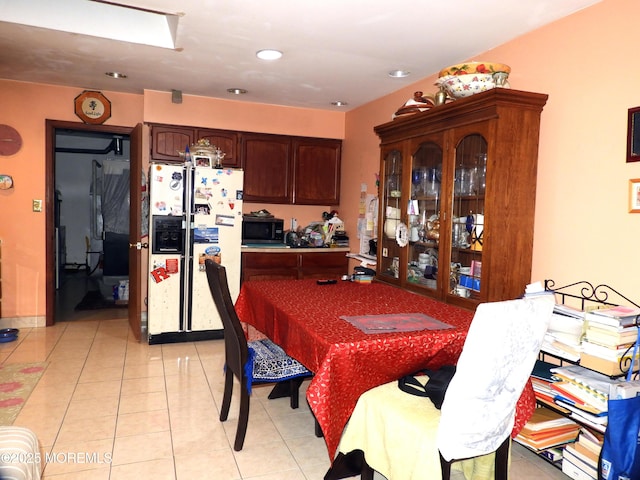 dining space featuring light tile patterned flooring