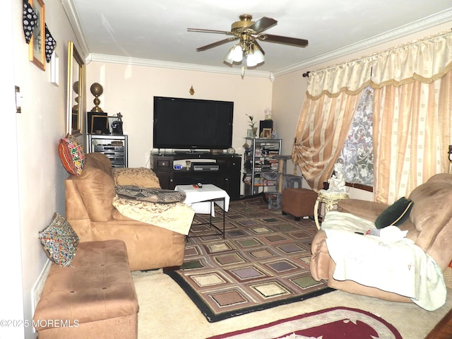 living room with ornamental molding, dark carpet, and ceiling fan