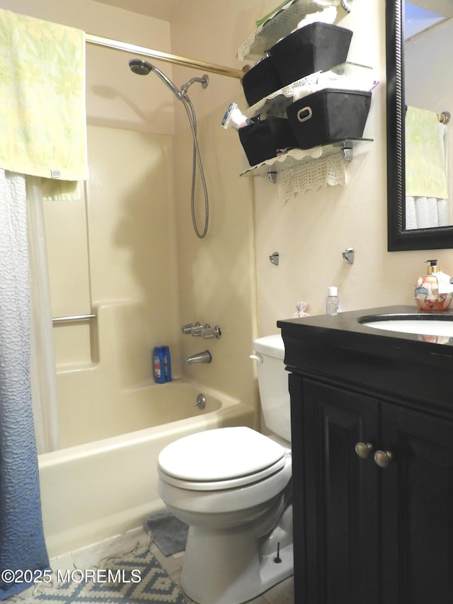 full bathroom with shower / bath combo, vanity, and toilet