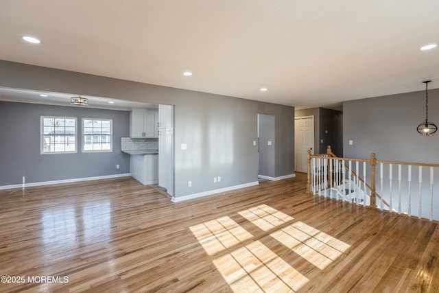 unfurnished living room featuring light wood-type flooring