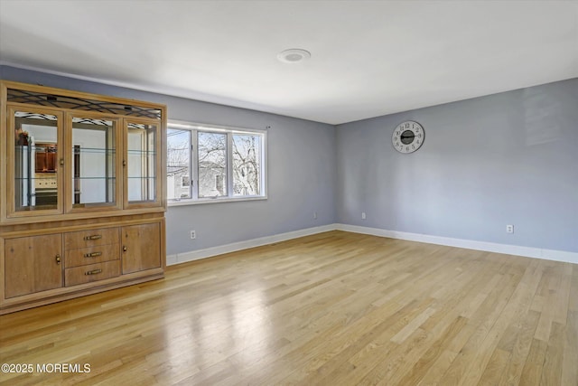 spare room featuring light hardwood / wood-style floors