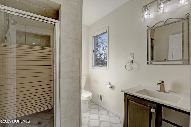 bathroom with walk in shower, vanity, and toilet