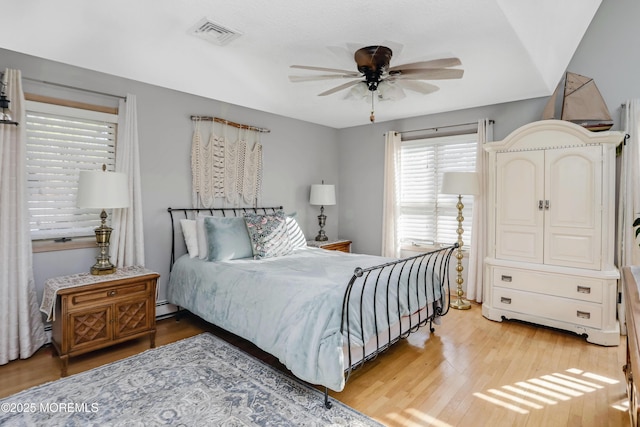 bedroom featuring hardwood / wood-style flooring and ceiling fan