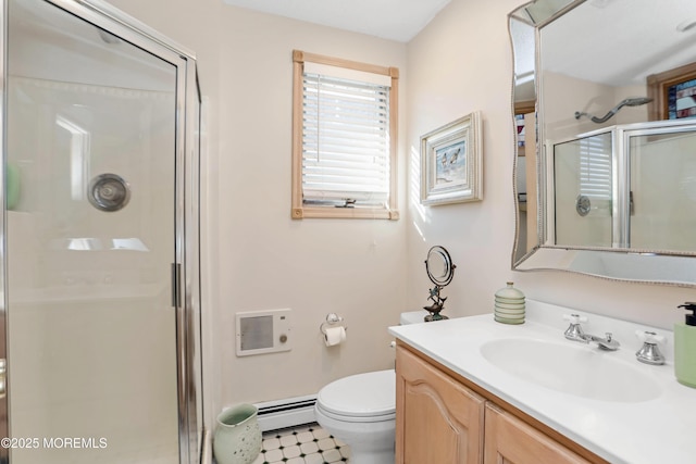 bathroom with vanity, toilet, baseboard heating, and walk in shower