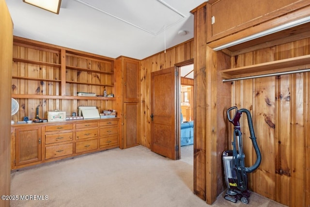 interior space featuring wooden walls and light carpet