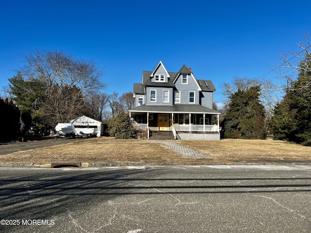 view of front of property with a garage and covered porch