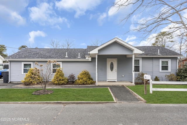 ranch-style house with a front yard