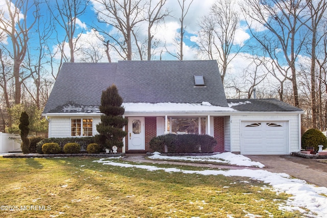 view of front of house with a garage and a lawn