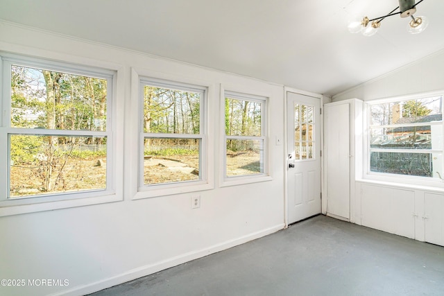 unfurnished sunroom featuring lofted ceiling