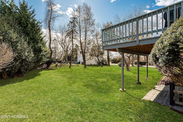 view of yard featuring a wooden deck