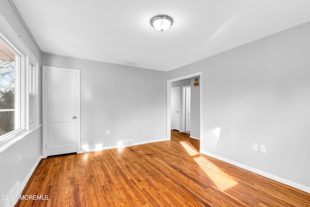 empty room featuring hardwood / wood-style flooring