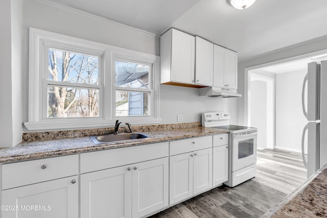 kitchen with sink, light wood-type flooring, white cabinets, light stone counters, and white appliances