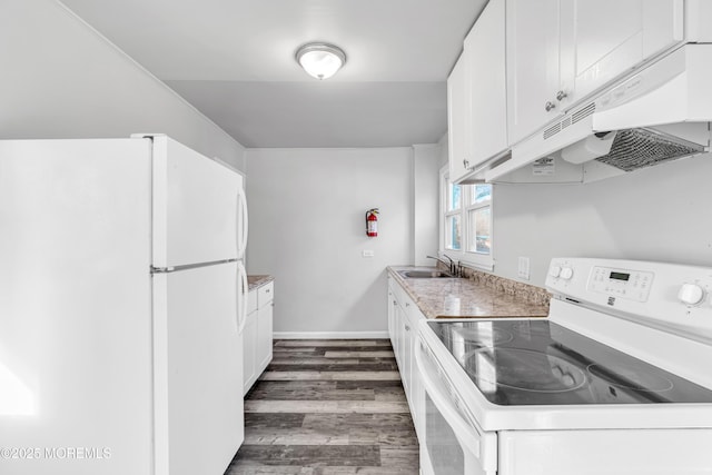 kitchen with white appliances, dark hardwood / wood-style floors, sink, and white cabinets