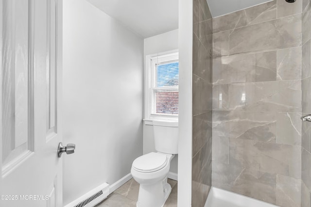 bathroom featuring toilet and tiled shower