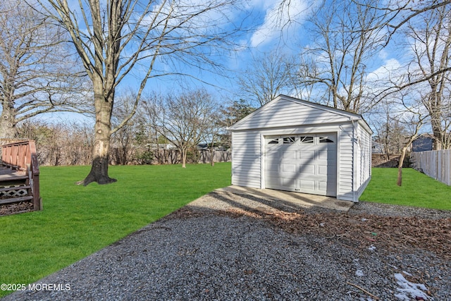 garage featuring a lawn