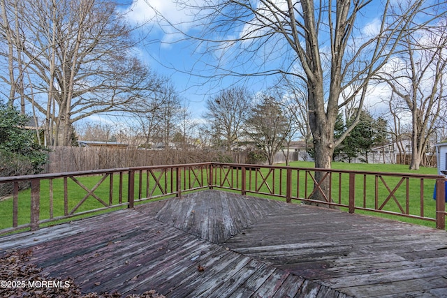 wooden terrace with a yard