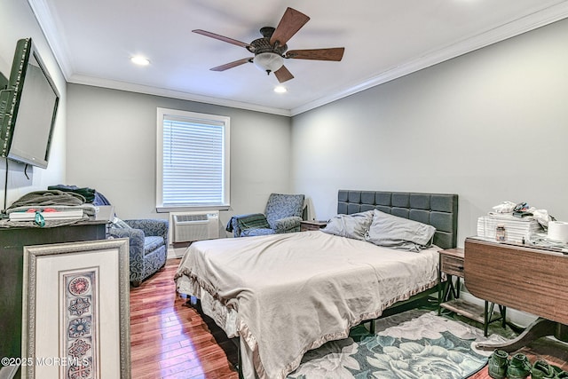 bedroom featuring crown molding, ceiling fan, wood-type flooring, and an AC wall unit