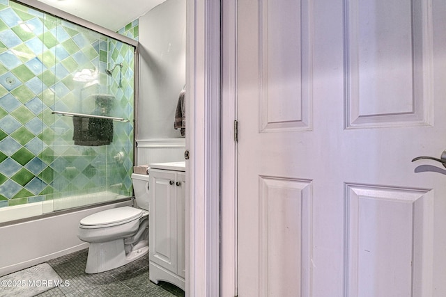 full bathroom with tile patterned flooring, vanity, toilet, and bath / shower combo with glass door