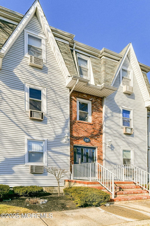 view of front of house featuring cooling unit