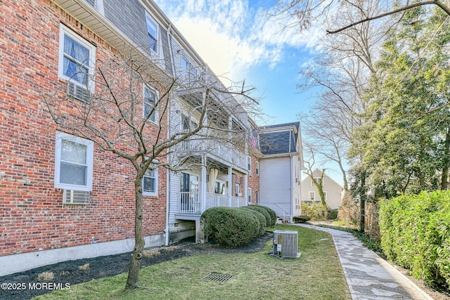 view of home's exterior with a lawn