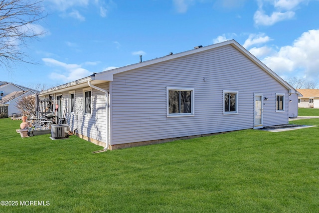 view of home's exterior featuring a yard and central air condition unit