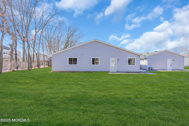 back of house with a yard