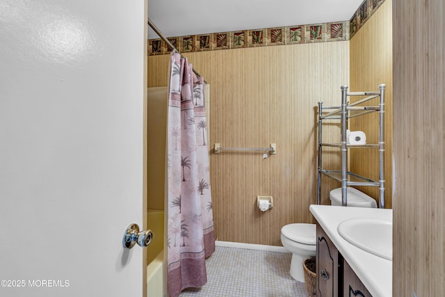 full bathroom featuring shower / tub combo with curtain, vanity, toilet, and tile patterned floors