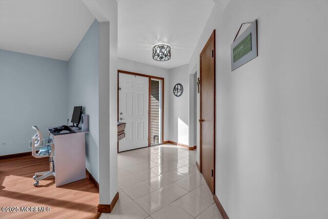 foyer entrance with light tile patterned flooring