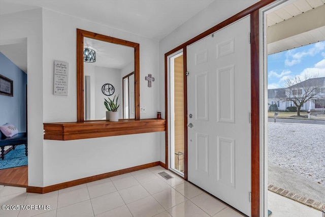 foyer with light tile patterned floors