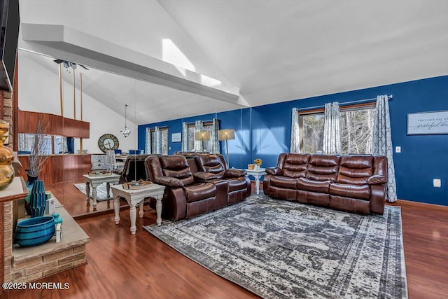 living room featuring hardwood / wood-style floors and high vaulted ceiling