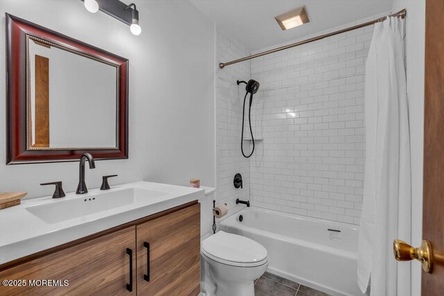 full bathroom featuring vanity, tile patterned flooring, toilet, and shower / bathtub combination with curtain