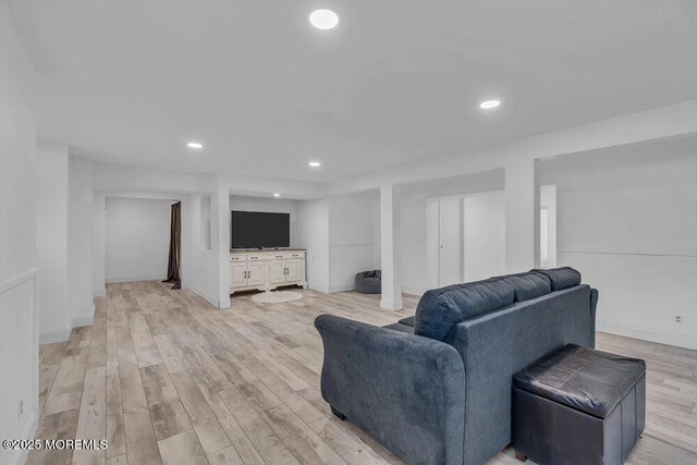 living room with light hardwood / wood-style flooring