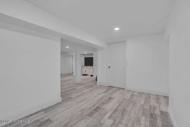 spare room featuring light wood-type flooring