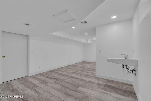 bathroom with hardwood / wood-style flooring