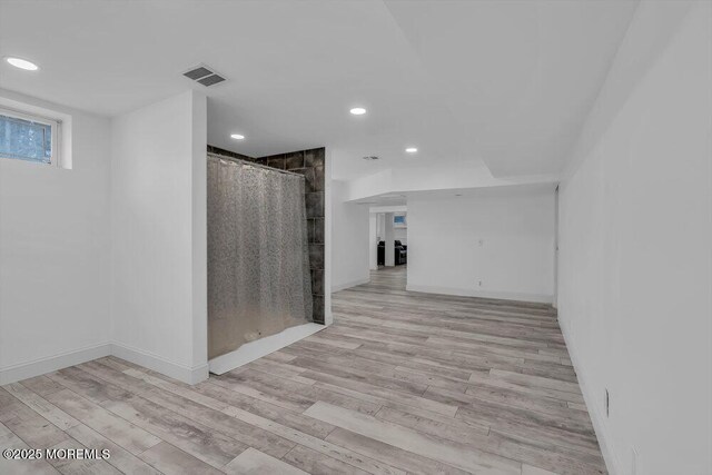 spare room featuring light hardwood / wood-style flooring