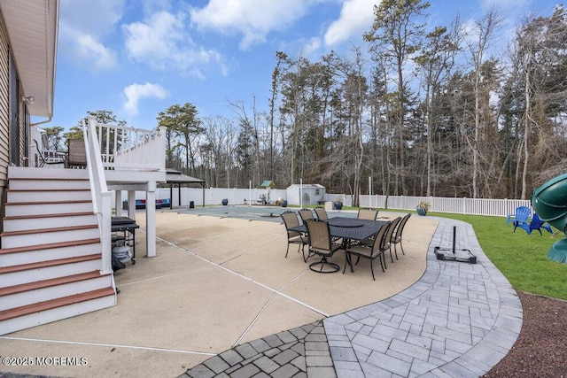 view of patio with a covered pool and a playground