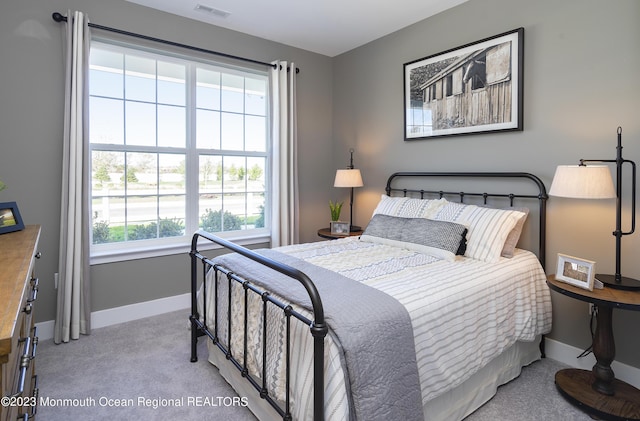 bedroom with light carpet