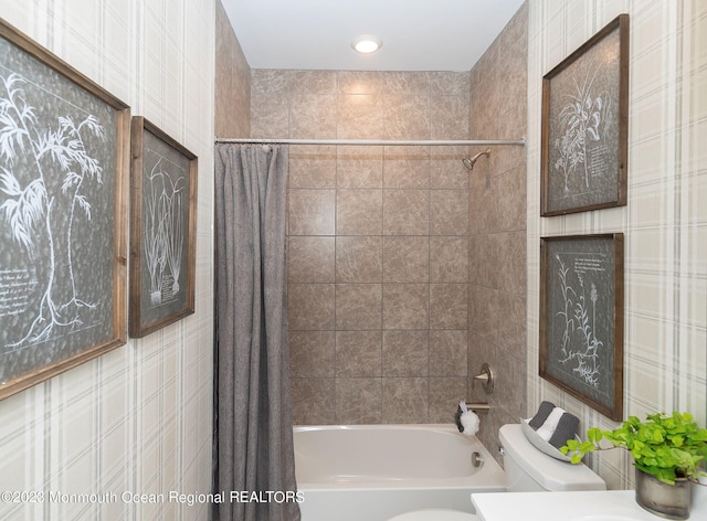 full bathroom featuring toilet, vanity, and shower / bath combo with shower curtain