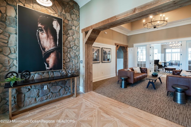 living room with a high ceiling and a notable chandelier