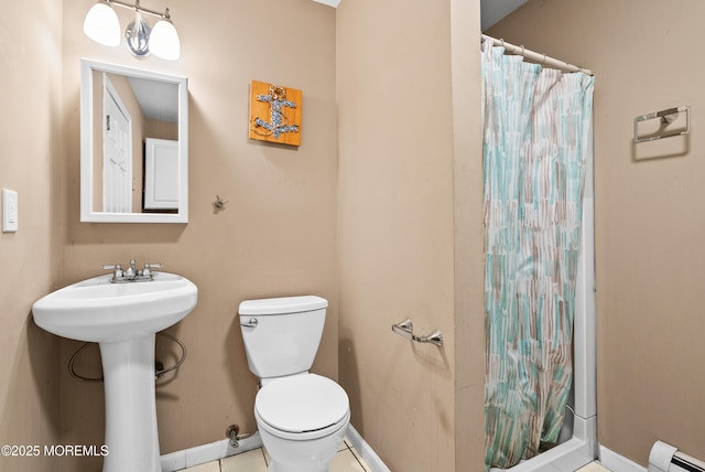 bathroom with sink, a baseboard radiator, toilet, and walk in shower