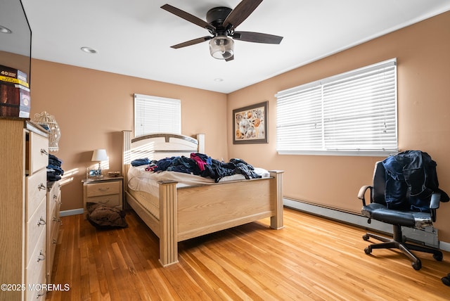 bedroom with wood-type flooring and ceiling fan