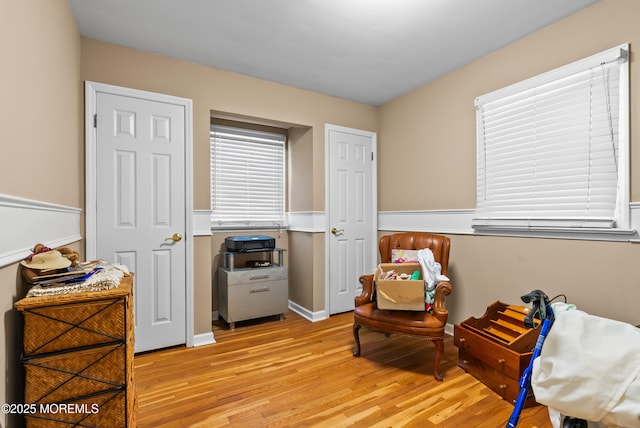 sitting room with light wood-type flooring